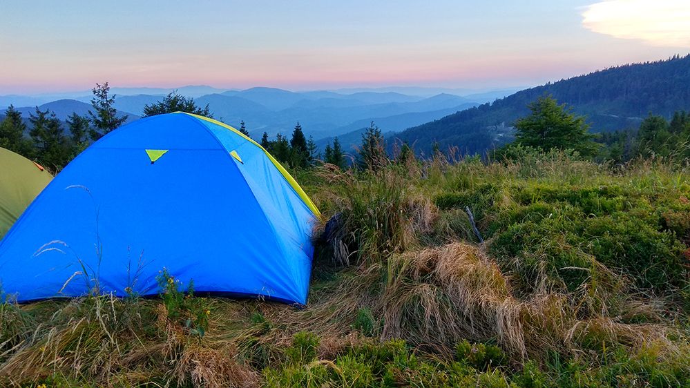 Caption: A photo of a tent pitched on a mountain at Skolivski Beskydy National Park in Lviv Oblast, Ukraine. (Local Guide Anastasiya Izmaylova)