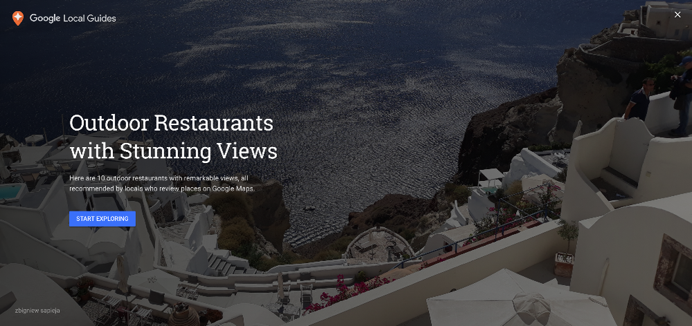 Caption: A screenshot of the opening screen on a Google Earth Voyager story called “Outdoor Restaurants with Stunning Views” featuring a photo of a gorgeous view of the ocean from a cliffside restaurant called Ambrosia Restaurant in Santorini, Greece.