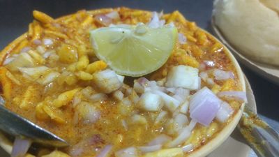 Misal with lemon on top of it