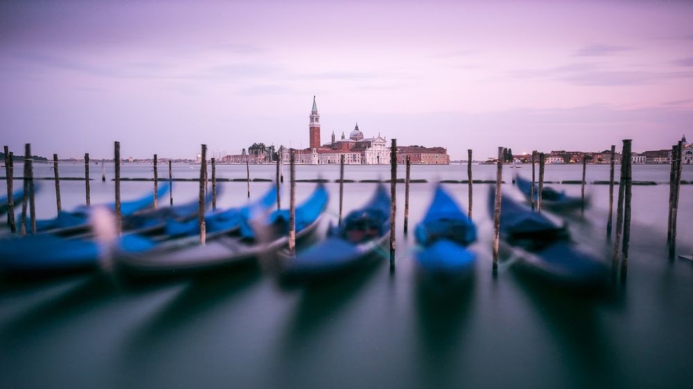 Caption: A photo of gondolas with a view of Church of San Giorgio Maggiore. Venice, Italy. (Local Guide Claus van Acken)