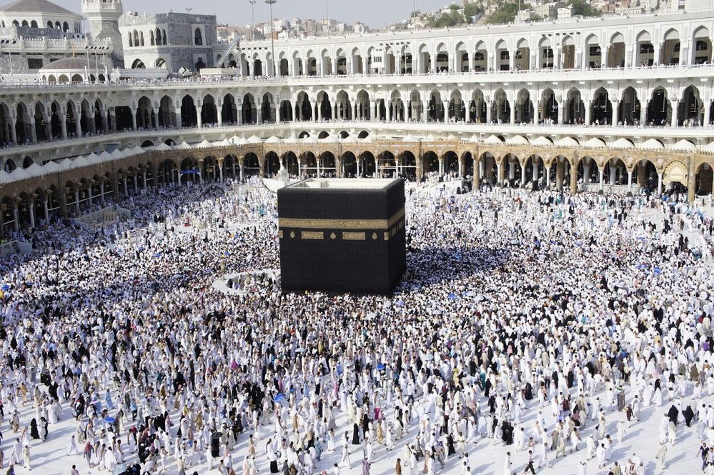 Caption: A photo of the Kaaba, a sacred structure in Mecca, surrounded by people taken during the daytime. (Local Guide Mohamed Gouda)