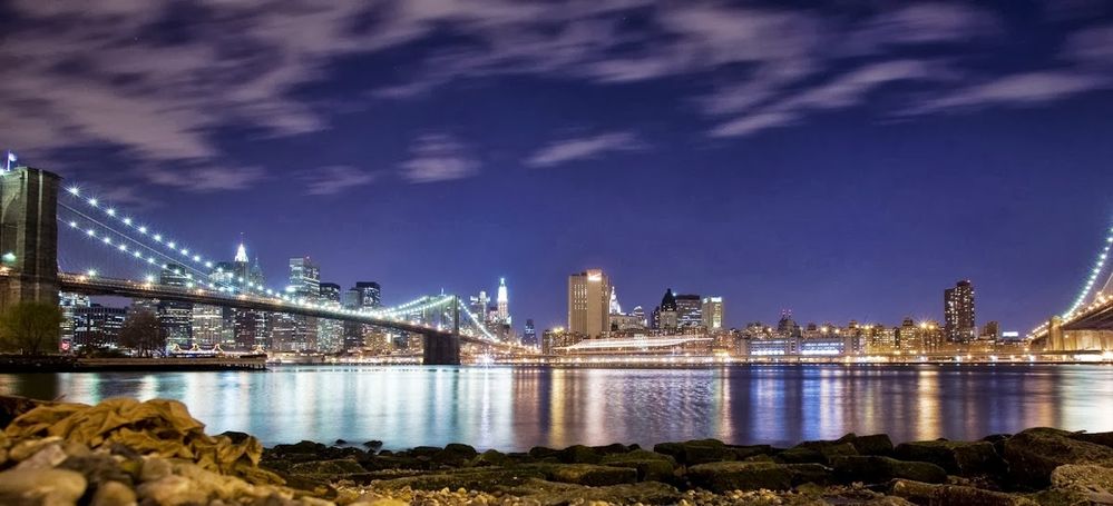 Caption: A photo of the New York City skyline at night taken from the Brooklyn Bridge. (Local Guide Bruce Friedman)