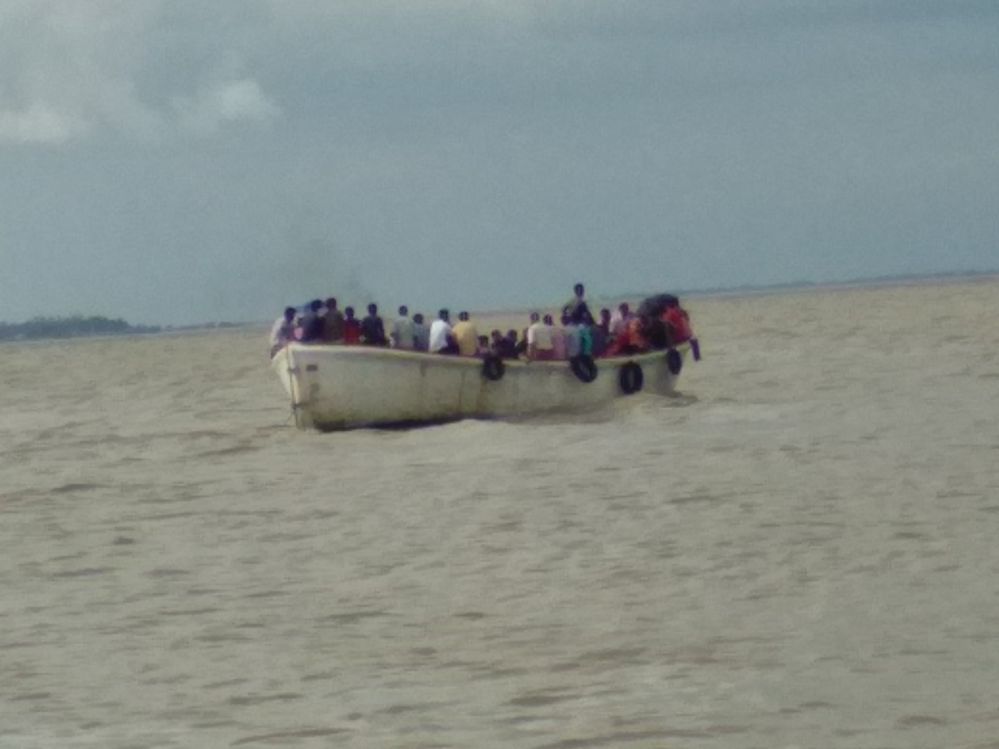 An old life boat is used to cross Kutubdia Channel.