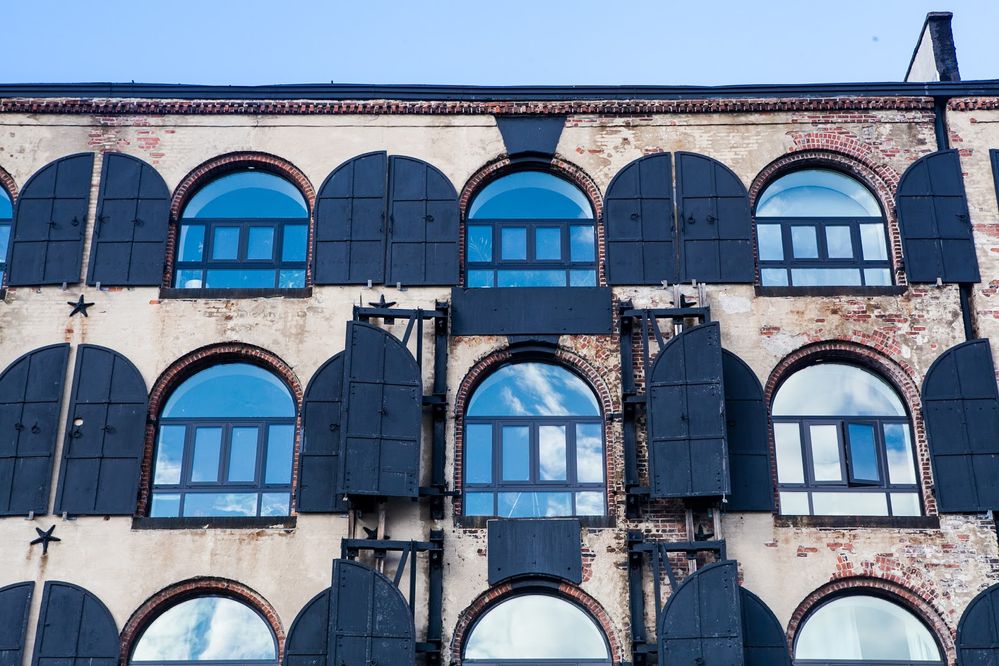 Caption: A photo of a blue sky reflected in windows of a building. (Local Guide Meng He)