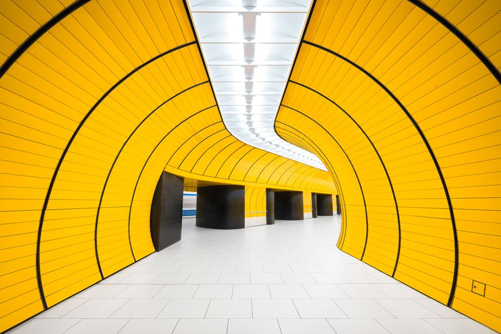 Caption: A photo of a passageway painted bright yellow in Marienplatz station in Munich, Germany. (Courtesy of Chris M. Forsyth)