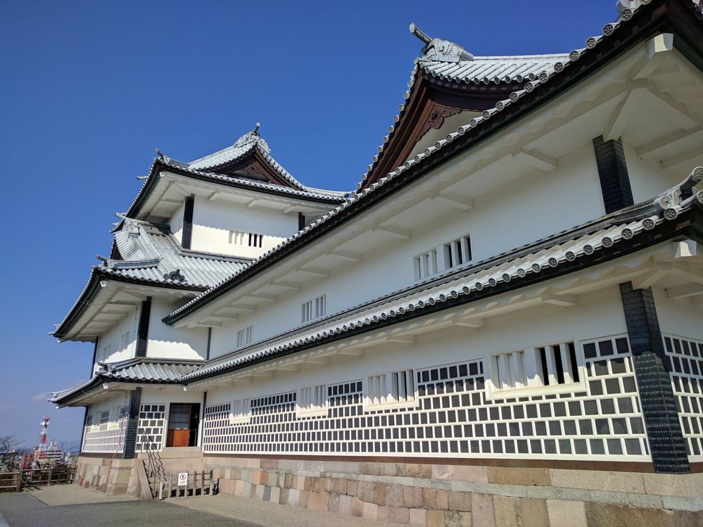 Caption: A photo of the exterior of Kanazawa Castle, a large, partially-restored castle in Kanazawa, Japan. (Local Guide nori o)