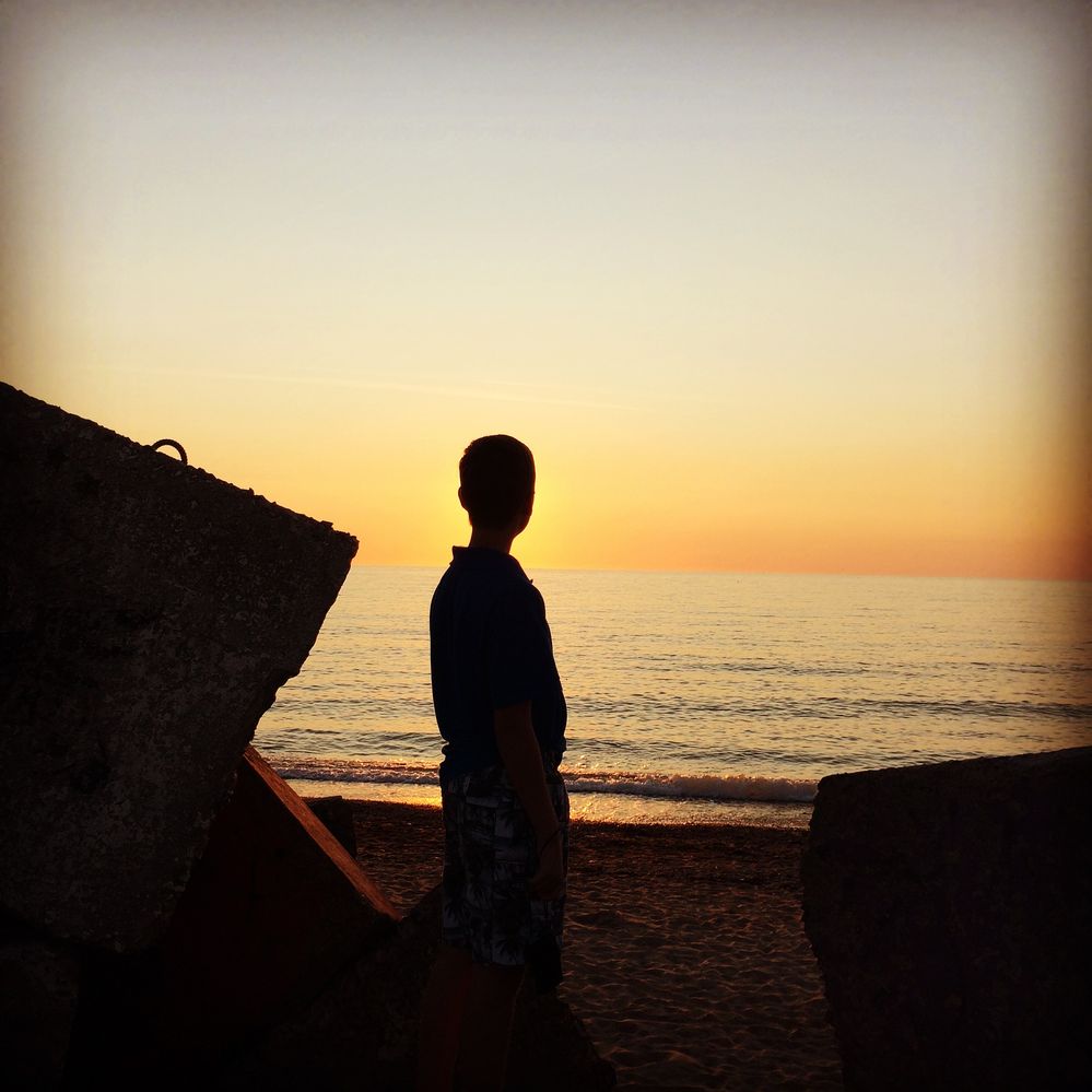 Me looking into the sunset of the sea in Liepaja, Latvia.
