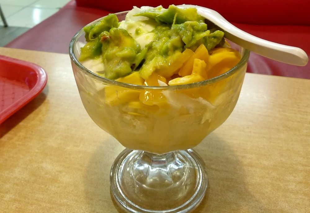 Caption: A photo of “es teler,” a fruit cocktail from Indonesia, topped with chopped mango and avocado at Es Teler 77 in East Java, Indonesia. (Local Guide Wulansari Dewi)