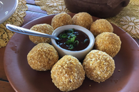 Caption: Pork croquete with barbecue sauce.