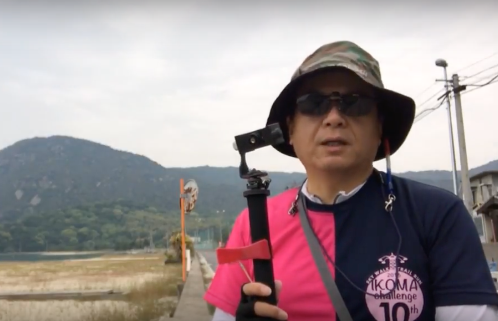 Caption: A photo of Local Guide @love_ikoma_toyo wearing sunglasses and a hat while holding a tripod with a camera on it. (Local Guide @love_ikoma_toyo)