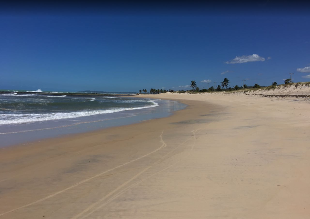 Caption: Photo of a desert beach, called "Sibaúma". Pipa, RN-Brazil.