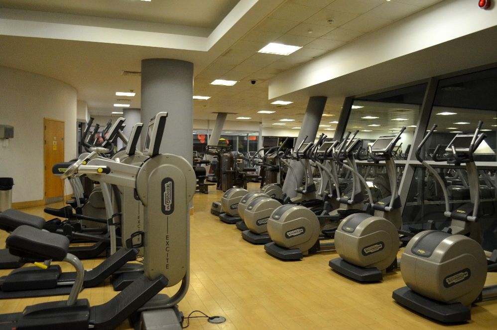 Caption: A photo of several ellipticals lined up next to each other facing a window at Swiss Cottage Leisure Centre in London, U.K. (Local Guide James Morgenstern)