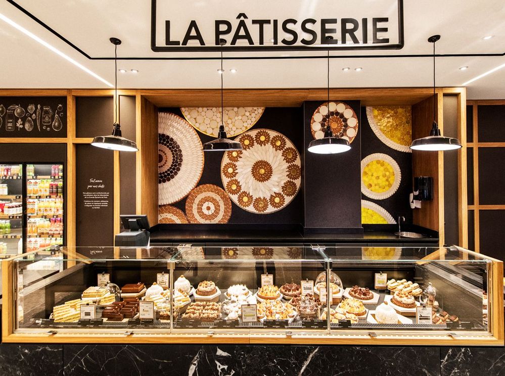 Caption: A photo of the patisserie at La Grande Epicerie de Paris, which features a glass counter display of pastries and cakes. (Local Guide Massimo Pastori)