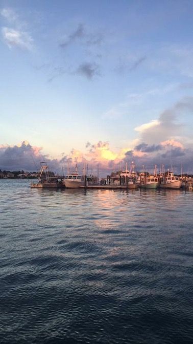 Caption: An evening-time photo of clouds, boats, and the intracoastal in Jupiter, Fla.