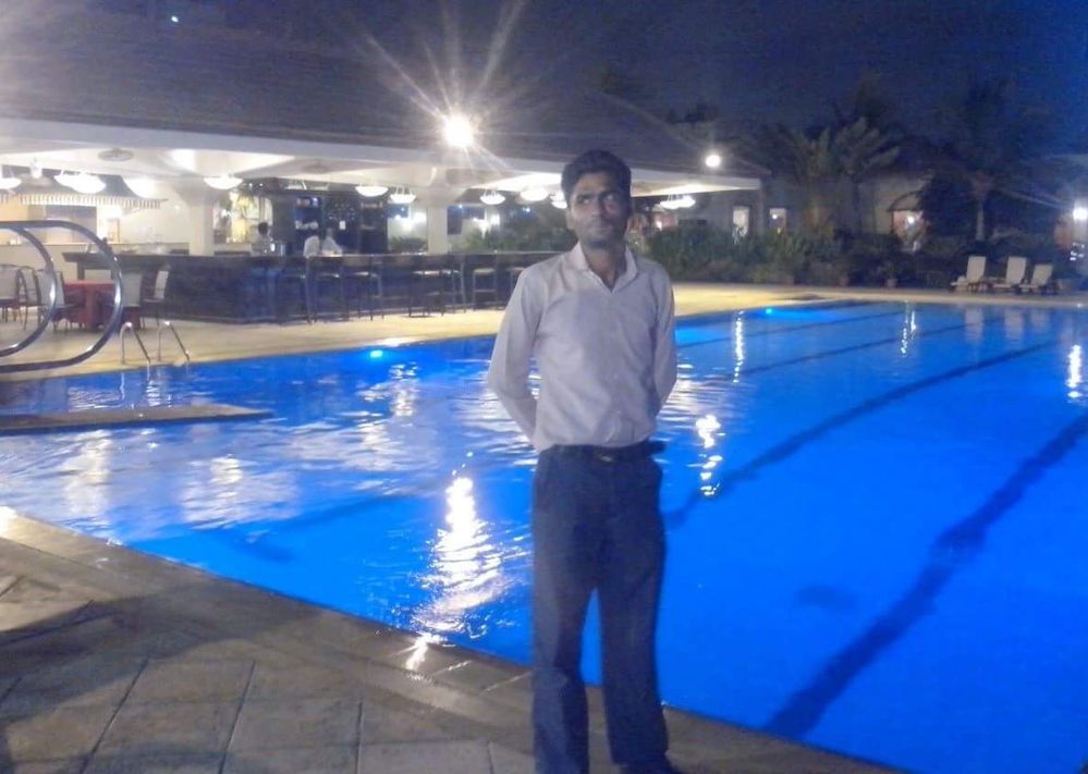 Standing at swimming pool