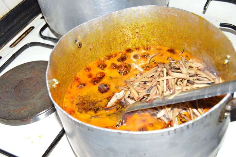 The oil bean (ukpaka) is added into the pot