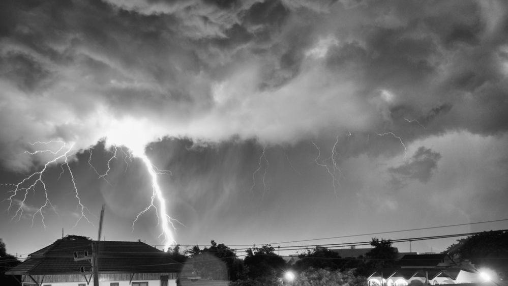 lightning strikes in a storm across chiang rai