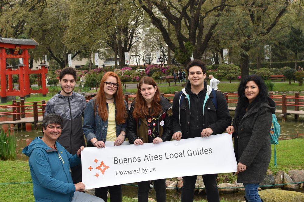 Caption: A photo of us posing with our "Buenos Aires Local Guides" sign. From left to right: Farid, Santiago, me, Daniel and Norma. Maximiliano took the photo.