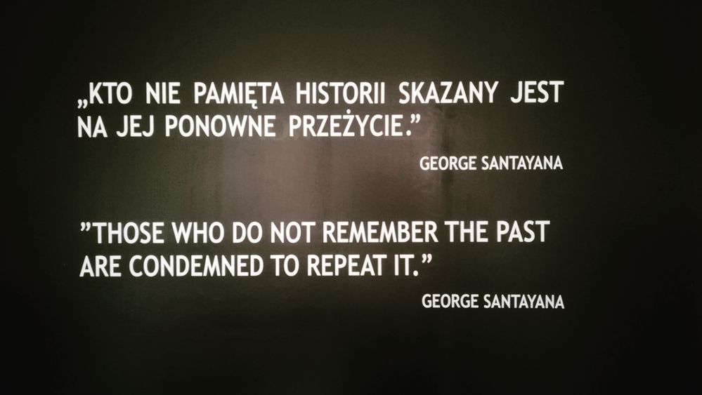 Caption: "those who do not remember the past are condemned to repeat it". The inscription has been photographed on the entrance of the first block on the  Auschwitz-Birkenau Museum, on Auschwitz Extermination Camp