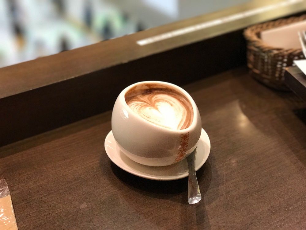 Caption: A photo of a coffee in a white cup topped with a heart design made out of foam. (Local Guide erfan nurhuda)