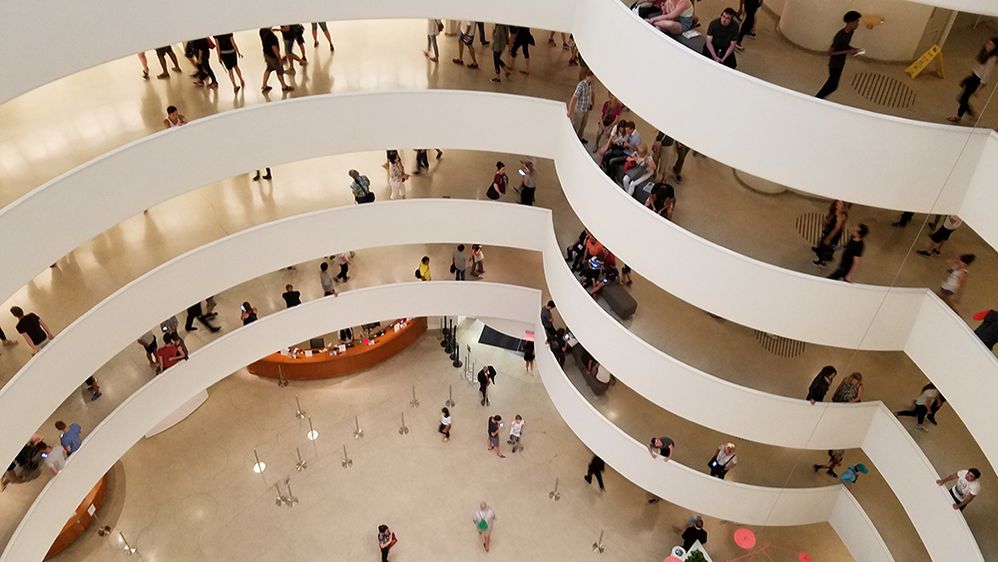 Caption: A photo of the interior of the Solomon R. Guggenheim Museum taken from a view from above in New York, New York, USA. (Local Guide Matt Moore)