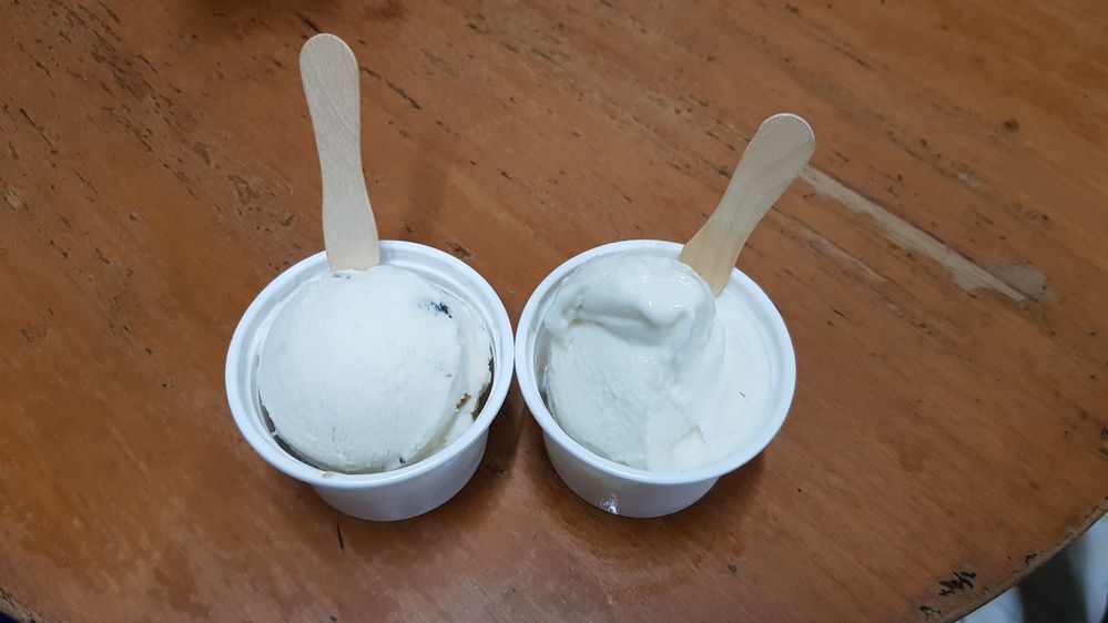 Caption: A photo of a cup of mint raisin ice cream and a cup of durian ice cream each with a small wooden spoon at Ragusa Italian Ice Cream in Jakarta, Indonesia. (Local Guide Jane Koh)