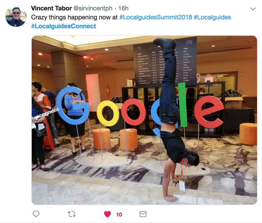 Caption: A Twitter post that shows a Local Guide doing a handstand in front of a Google sign.  (@sirvincentph)