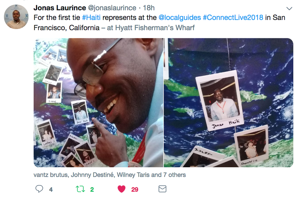 Caption: A Twitter post that shows the first Haitian Local Guide to attend Connect Live pinning a photo of himself to a globe. (@jonaslaurince)