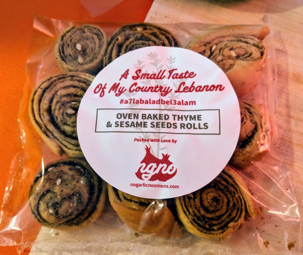 Caption: A photo of Local Guide Anthony’s homemade oven baked thyme and sesame seed rolls in clear plastic packaging with a label that says, “A small taste of my country Lebanon.”