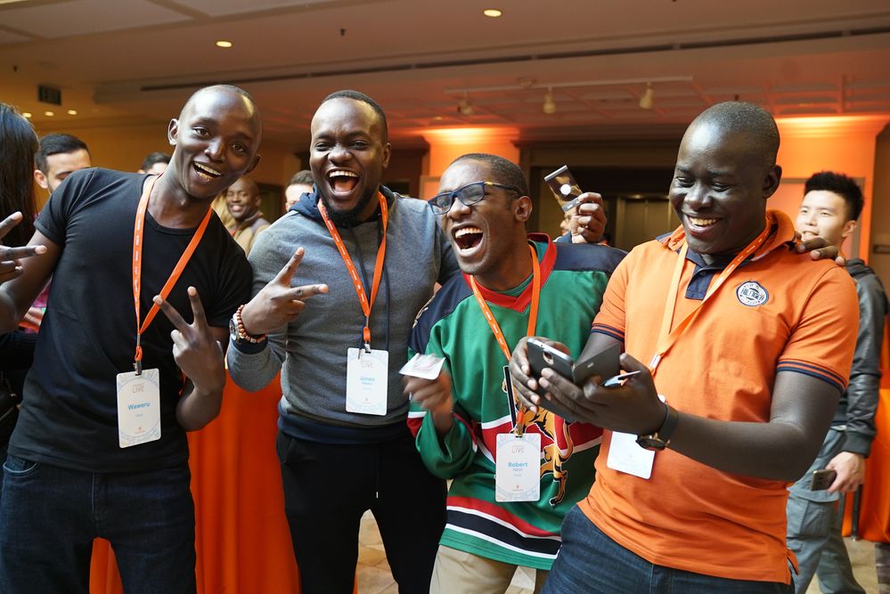 Caption: An image of a group of Local Guides laughing at Connect Live 2018.