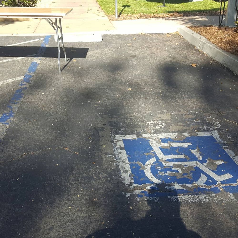 Caption A wheelchair sign indicating parking lot for people with disability at the  Googleplex