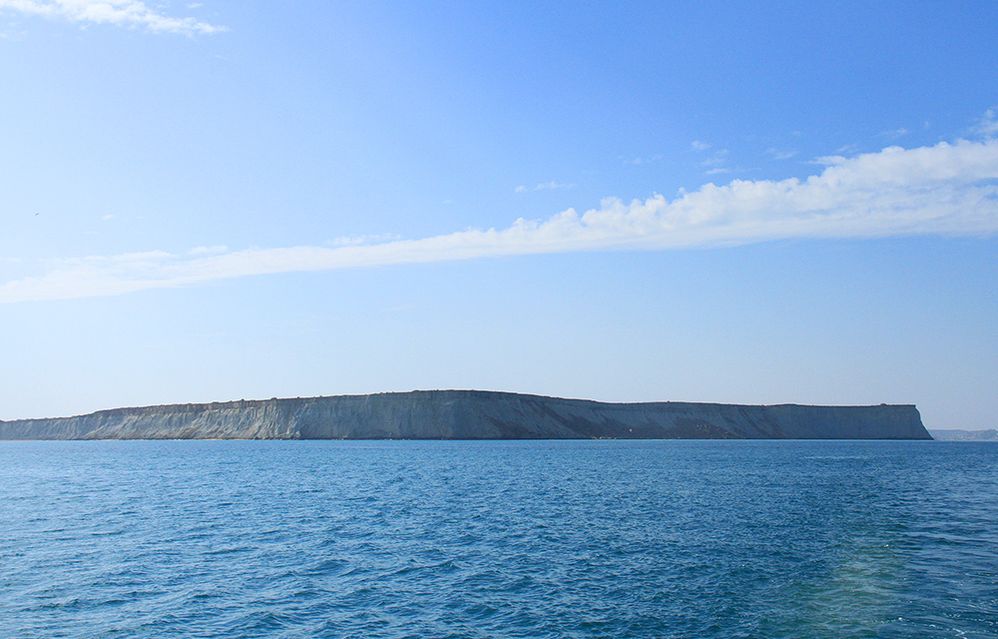 A small island near Chabahar, Iran and waters of Oman Sea with clean sky
