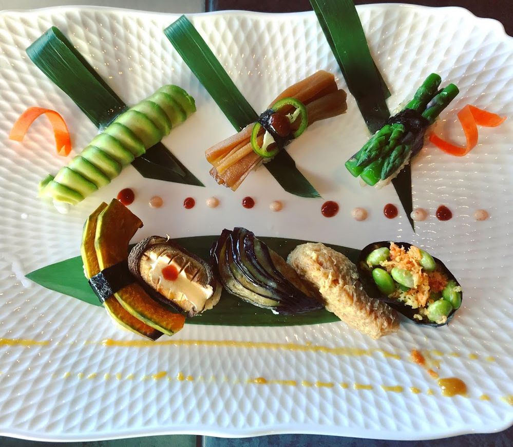 Caption: A photo of a variety of sushi on a plate shot from above, taken at Sushi on La Cienega in Okinawa, Japan.  (Local Guide Carolyn S.)
