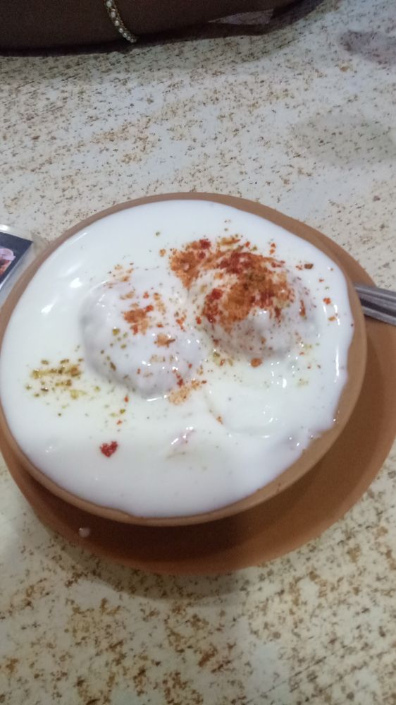 "Dahi Vada" Sweet curd served with Vada which is fried in oil the spices sprinkle for unique taste famous in North and West India