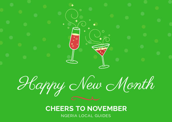 Caption: A digital card with a green background, two glass cups filled with wine and  text readngHappy New Month