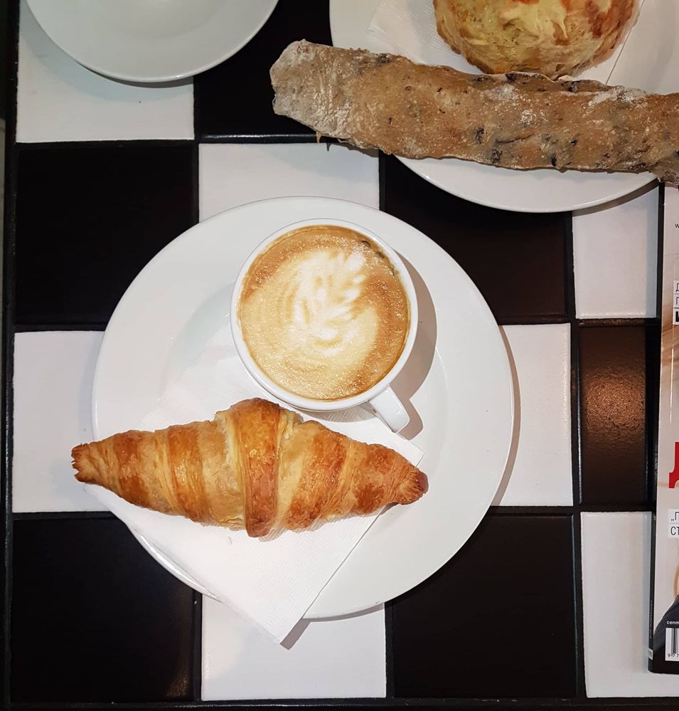 Caption: Cappuccino and a butter croissant, Cafe Ma Baker, Sofia Bulgaria
