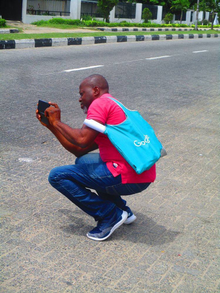 Sanya taking a shot during Lagos 36 walk