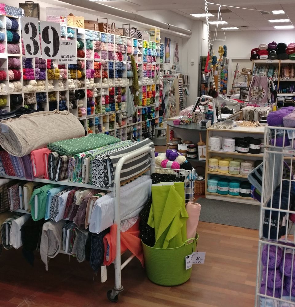 Caption: A photo of the interior of a craft store in Rødovre, Denmark filled with colorful yarn, fabric, and other supplies. (Local Guide Dagmar Thorisdottir)