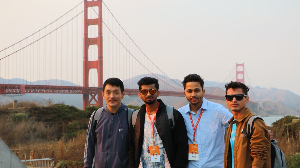 Caption: A photo of Stephen with his Local Guides friends: Alam, Rahul, and Deep at the Golden Gate Bridge in San Francisco during Local Guides Summit 2017.