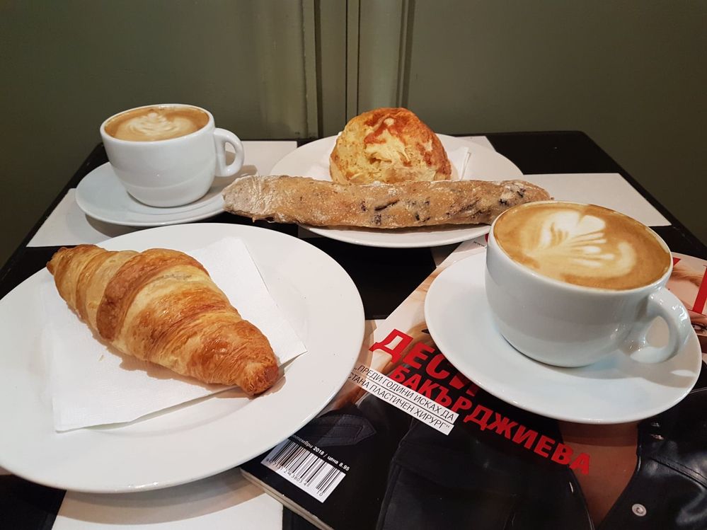 Caption: Two cappuccinos, butter croissants, bread with olives and mozzarella bun, Cafe Ma Baker, Sofia (Local Guide @InaS)