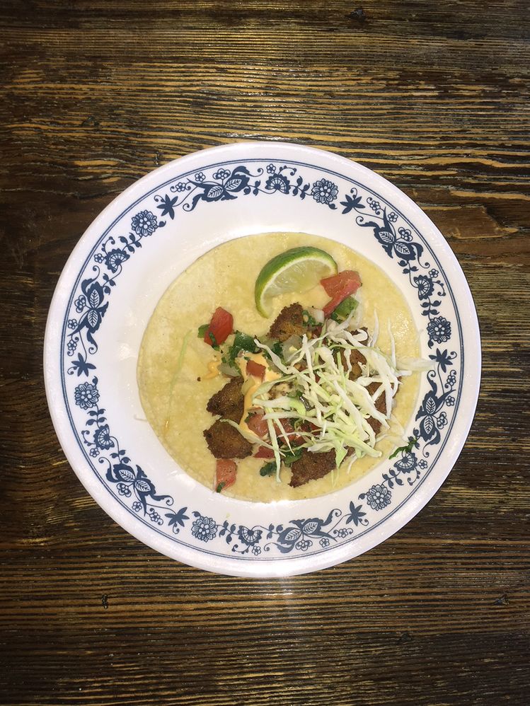 Caption: A photo of an open taco on a plate photographed using flash. (Wendy George)