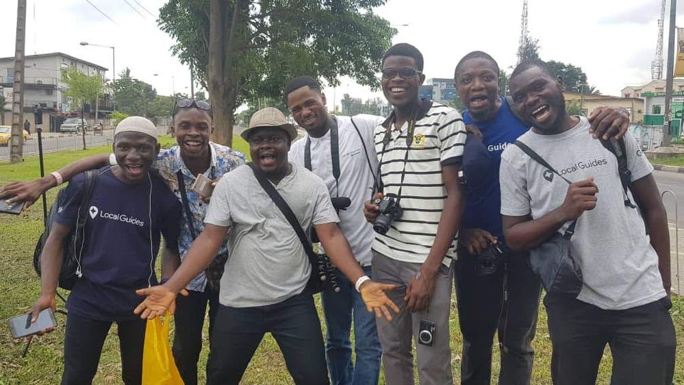 Caption a cross section of Local Guides smiling and cheering during a group photograph at the 360 Photo Walk meet-up in Lagos, Nigeria
