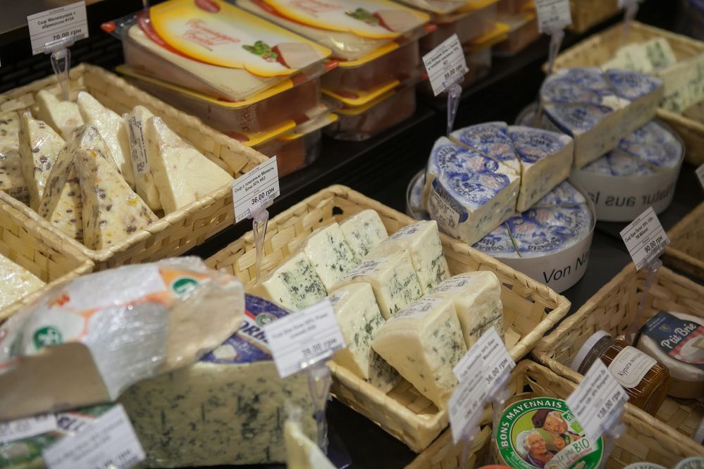 Caption: A closeup photo of a variety of cheeses for sale in a grocery store in Poltava, Ukraine. (Local Guide Alexander Vanin)