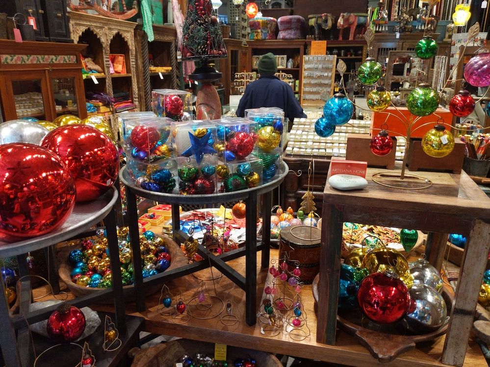 Photo Caption: A multi-colored Christmas ornament display inside a shop.