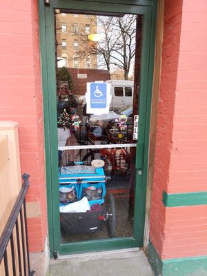 Photo Caption: An accessible side entrance with a stroller inside blocking the door.