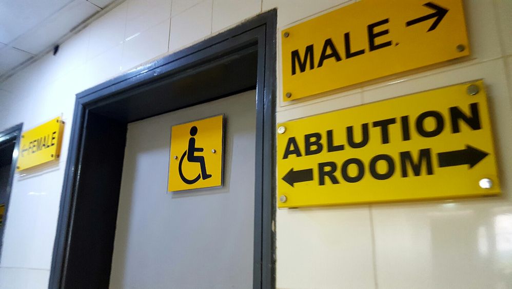 Caotion: Accessibility Sign at the Lagos Airport restroom