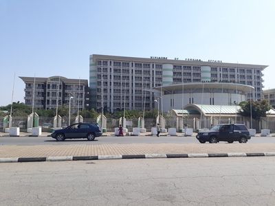 A picture of the front of the Ministry of Foreign Affairs which shows raised slaps on the sidewalks and boulevard
