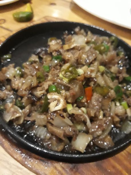 Pork Sisig --- is a Filipino dish made from parts of pig head and liver, usually seasoned with lemon and chili peppers.