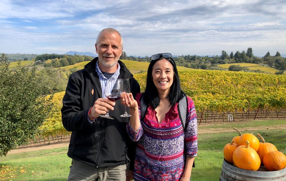 Caption: A photo of Local Guides @ermest and @KarenVChin clinking glasses outdoors at Iron Horse Vineyards in Sebastopol, California. (Local Guide @KarenVChin)