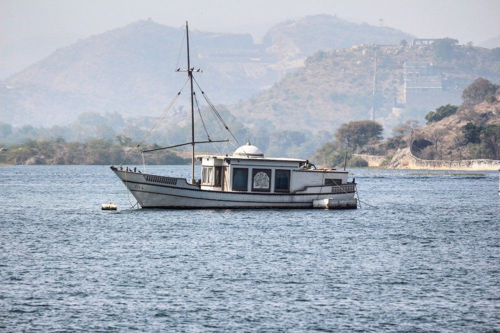 Caption: A photo of a boat on the water in Lake Pichola in Rajasthan, India. (Local Guide Kinshuk Khurana)